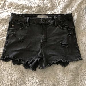 Black cut off shorts.